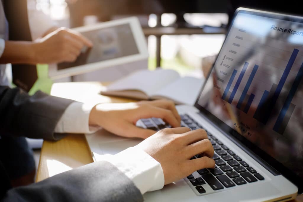 Business man using laptop computer for a analysis financial data,finance control concept.